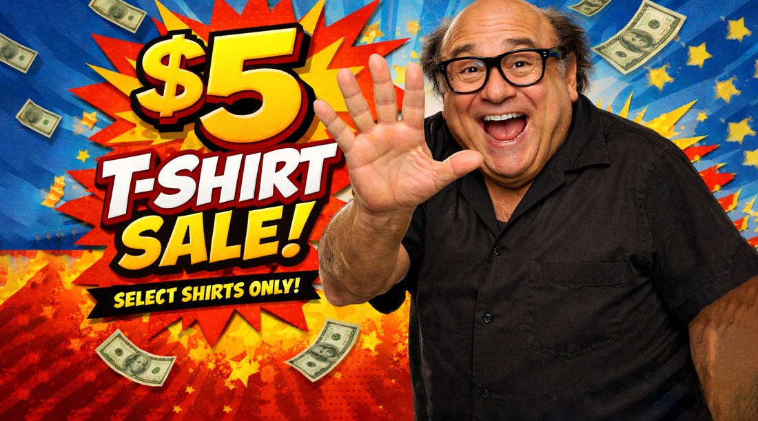 Danny DeVito in front of a colorful '$5 T-Shirt Sale!' advertisement.