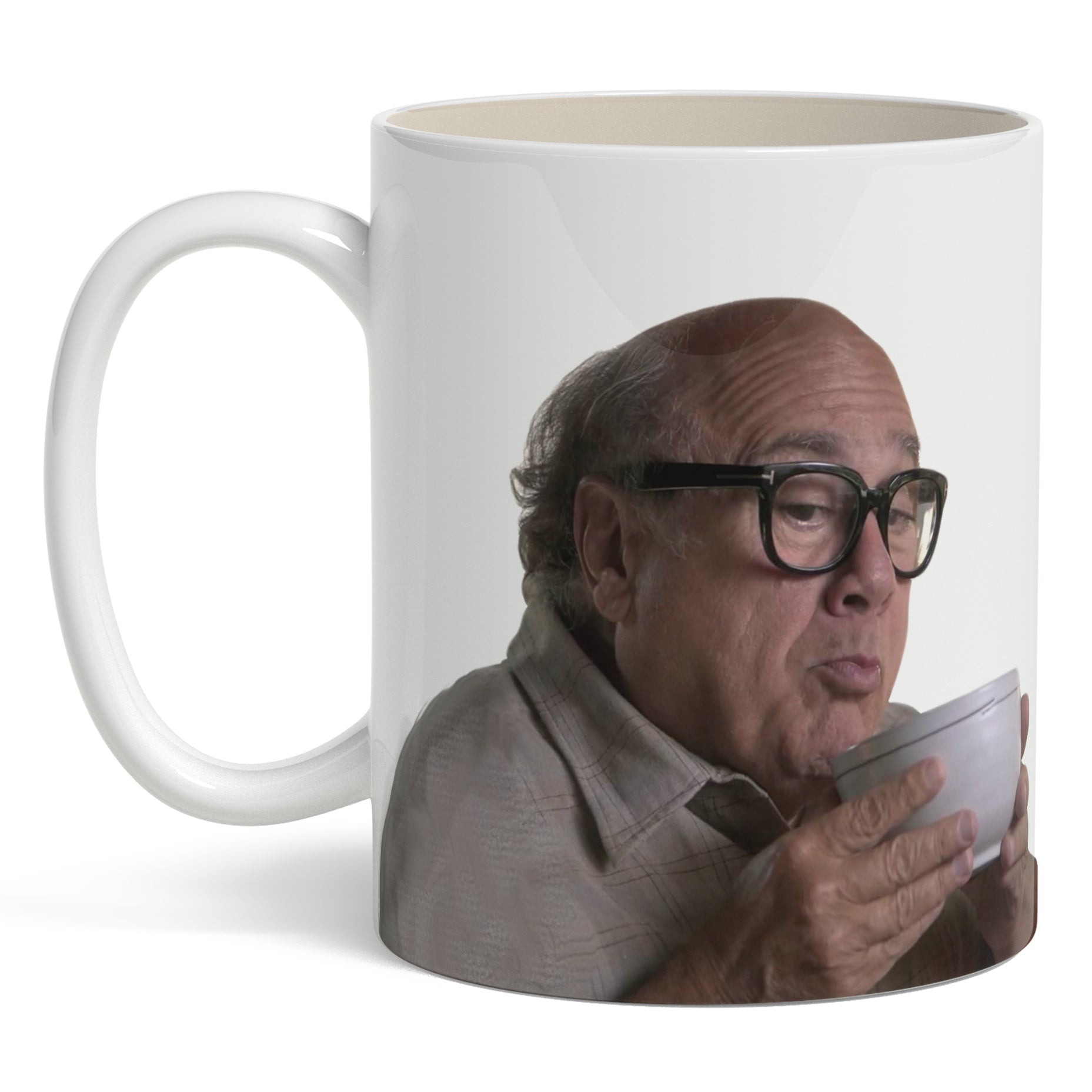 Mug with a printed design of Danny DeVito holding a coffee cup on a white background