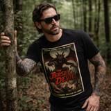Man wearing a black t-shirt with 'The Jersey Devil' graphic design in a forest setting