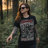 Woman wearing a black t-shirt with 'The Jersey Devil' graphic design in a forest setting