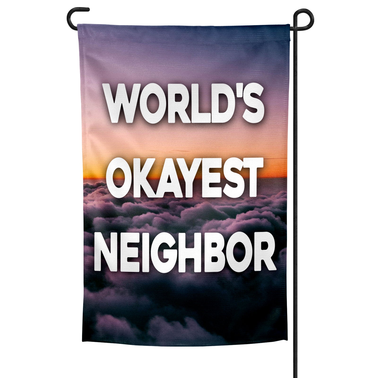 A rectangular garden flag with a purple and orange cloud-filled sky background and the text 'WORLD'S OKAYEST NEIGHBOR' in bold white letters.